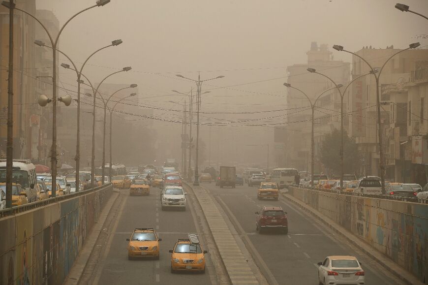 Thick white dust covers the Iraqi capital Baghdad with visibility down to a few hundred metres on June 13, 2022