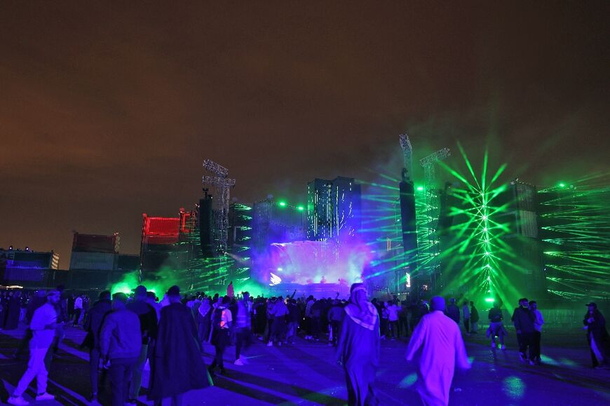 People attend the Soundstorm music festival, organized by MDLBEAST, in Banban on the outskirts of the Saudi capital Riyadh on December 16, 2021
