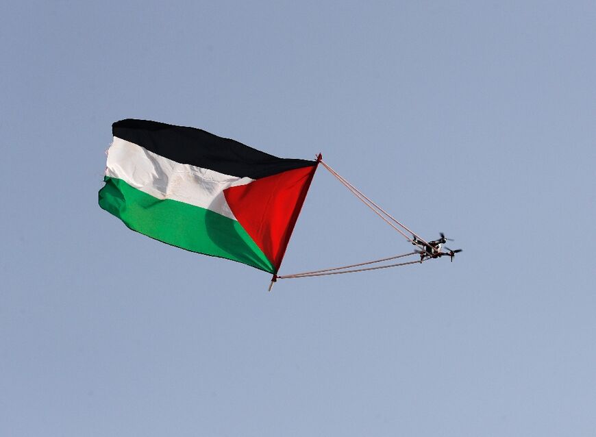 A Palestinian flag hanging from a civilian drone that flies over Jerusalem on May 29, 2022, during the Israeli 'flags march' to mark "Jerusalem Day"