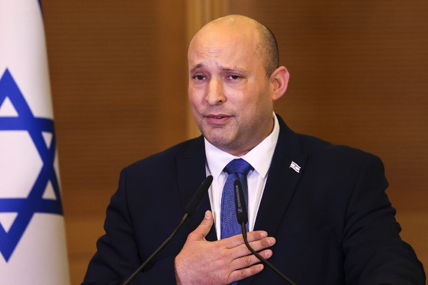 Israel's outgoing Prime Minister Naftali Bennett speaks to lawmakers from his Yamina party at the Knesset 