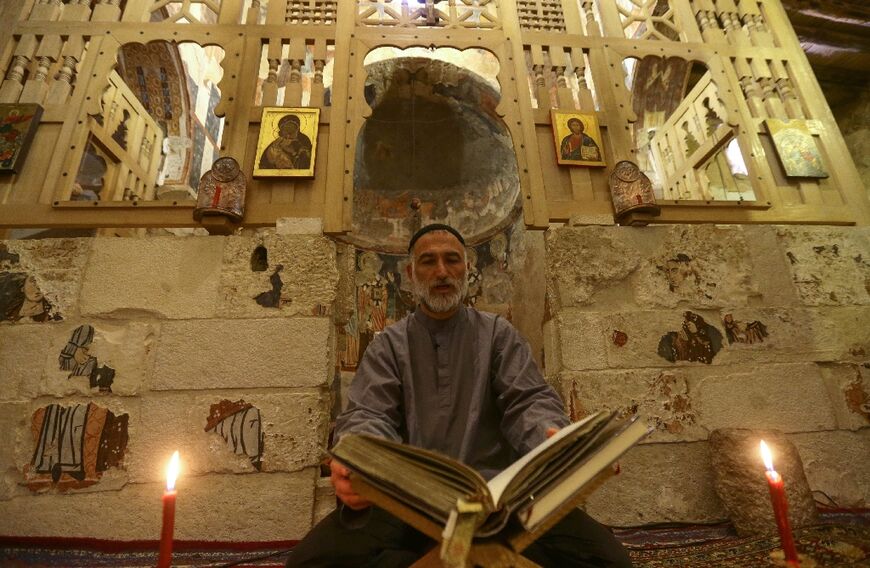 Father Jihad Youssef sits in prayer and contemplation at the monastery, where there is no internet or cell coverage