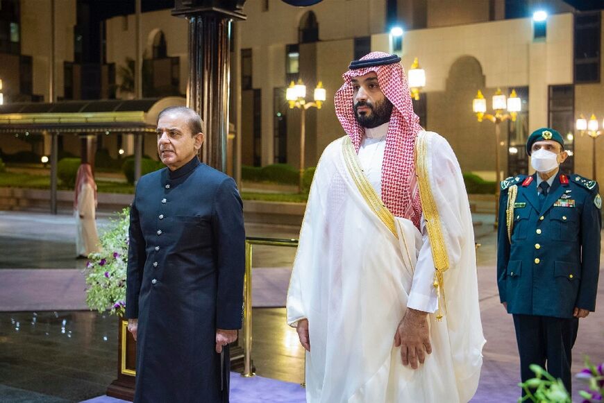 During his trip to Saudi Arabia, Biden is expected to meet with the oil-rich nation's crown prince and de-facto leader Mohammed bin Salman (R) -- seen in this handout image by the Saudi Royal family welcoming Pakistan's prime minister in April 2022