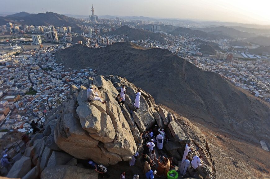 Muslim pilgrims are pictured at the Jabal al-Noor 'mountain of light' overlooking the holy city of Mecca 