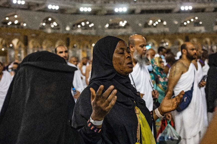 A Muslim pilgrim prays near the Kaaba, Islam's holiest shrine