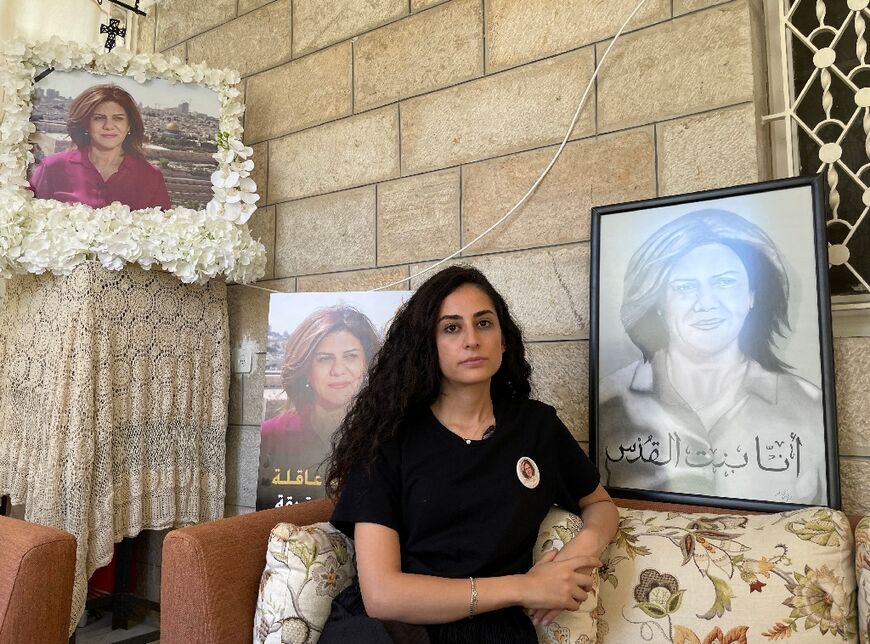 Lina Abu Akleh, surrounded by pictures of her aunt, is still getting used to the fact that the veteran correpondent will never again report for Al Jazeera