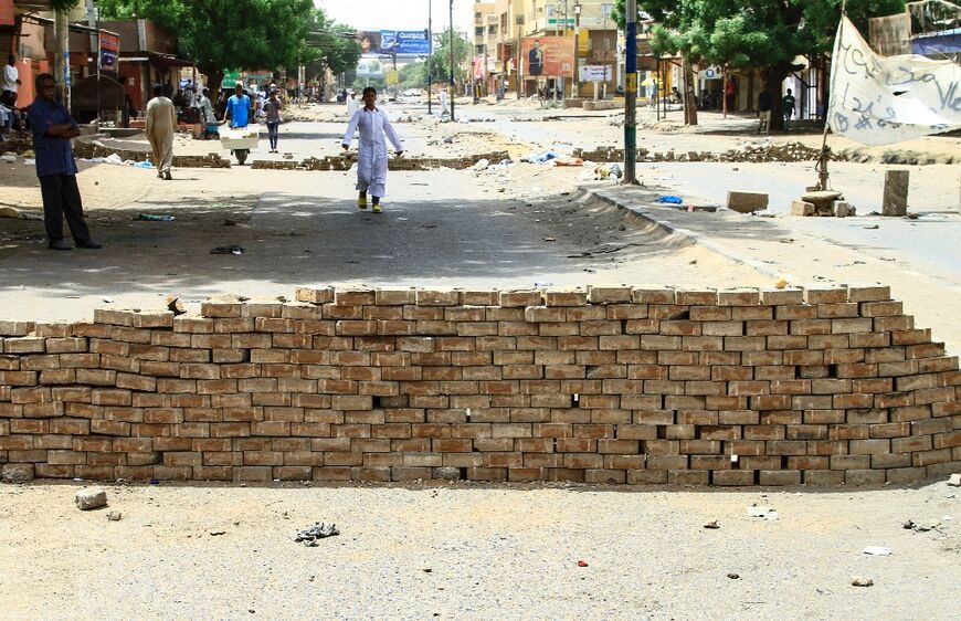 Protesters used bricks to barricade roads in North Khartoum