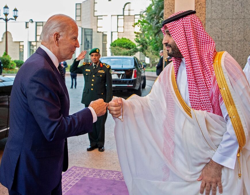 Saudi Crown Prince Mohammed bin Salman (R) bumps fists with US President Joe Biden at Al-Salam Palace in the Red Sea port of Jeddah