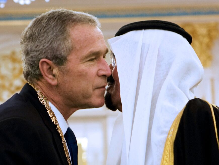 Saudi King Abdullah bin Abdul Aziz al-Saud (R) embraces US President George W. Bush on the cheek as he arrived for a visit to the oil-rich kingdom in May 2008
