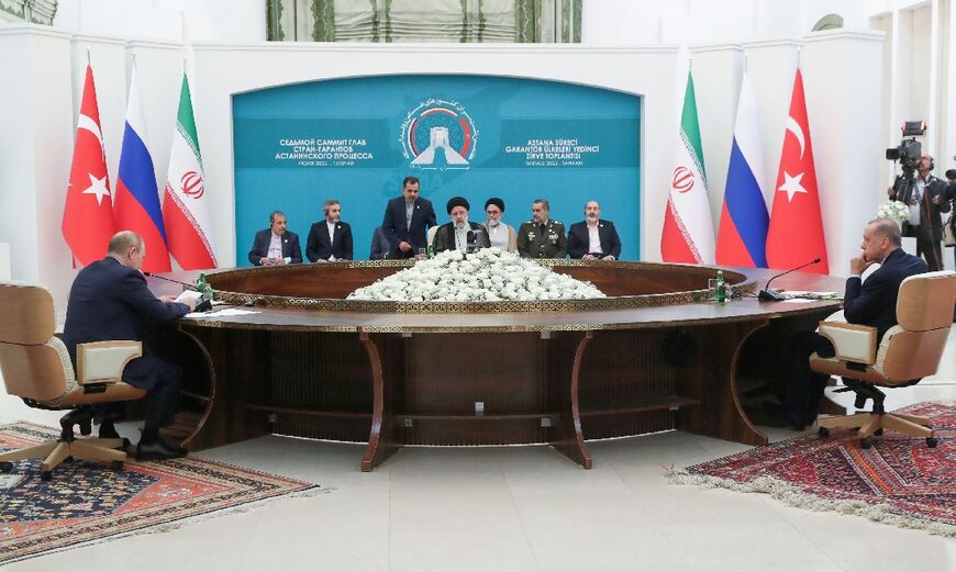 Iran's President Ebrahim Raisi (C), Russian President Vladimir Putin (L), and Turkish President Recep Tayyip Erdogan during their summit in Tehran on Tuesday