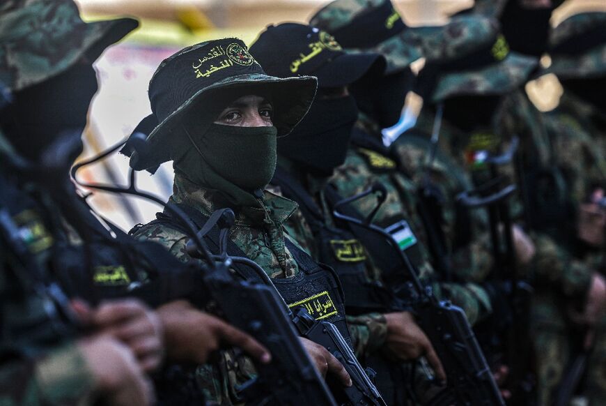 Palestinian fighters from Islamic Jihad attend a mourning gathering on August 8, 2022 -- a member of the group's political bureau said it lost "many major military leaders"