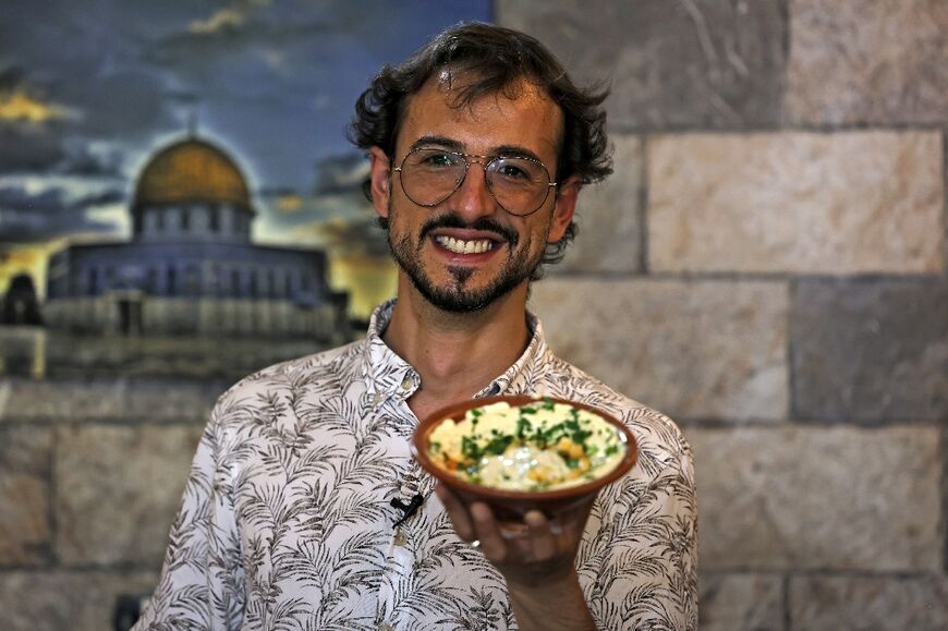 Izzeldin Bukhari, who runs Jerusalem food tours and cooking classes, during a guided tour in the Old City of Jerusalem  
