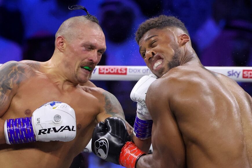 Ukraine's Oleksandr Usyk, left, won his rematch against Anthony Joshua of Britain by split decision to retain his world heavyweight titles in just his fourth fight in the division in Saudi Arabia 