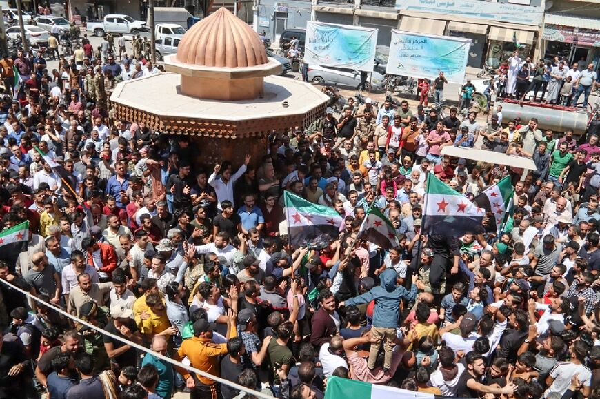 Syrians protest in the border town of Azaz in the rebel-held north of the Aleppo province