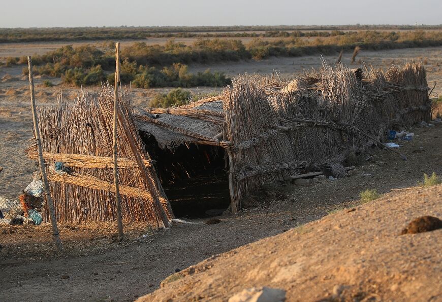 An abandoned shack in the once-lush Huwaizah Marshes -- "We are at a loss where to go," says struggling buffalo keeper Hashem Gassed