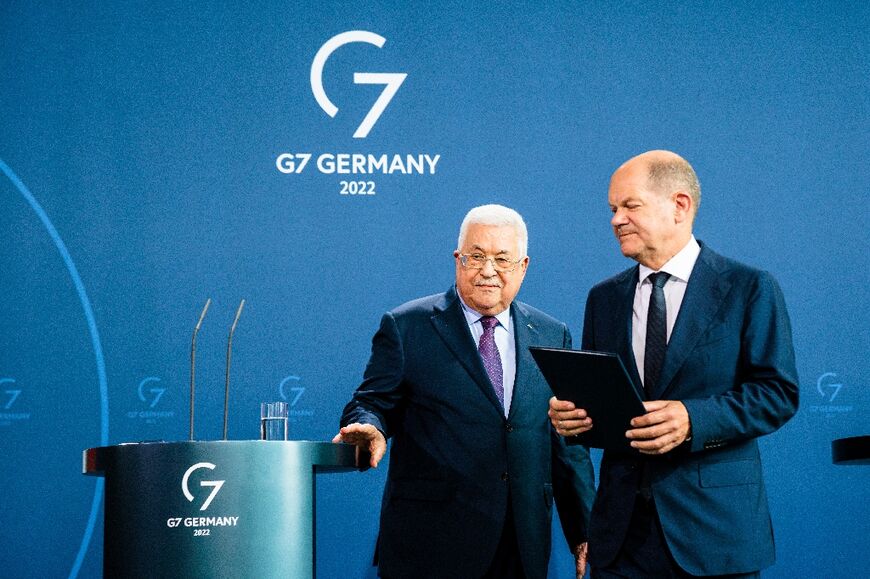 German Chancellor Olaf Scholz and Palestinian president Mahmud Abbas leave after the Berlin press conference on August 16, 2022