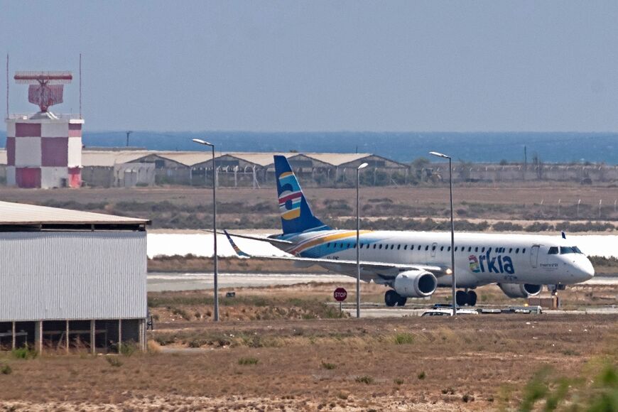 The Israeli airline Arkia, carrying a group of Palestinians on the first flight from Israel's Ramon airport, lands at Larnaca International Airport in Cyprus