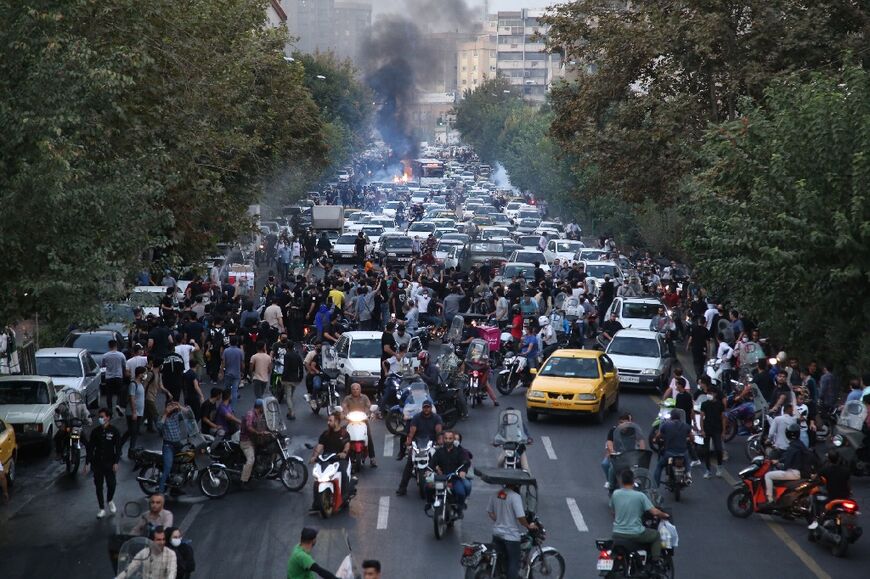 A picture obtained by AFP outside Iran shows protesters blocking traffic on a busy highway in Tehran