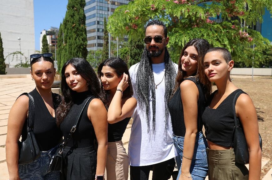 Five dancers of the all-women troupe Mayyas are pictured with choreographer and founder Nadim Cherfan in Beirut on June 29, 2022