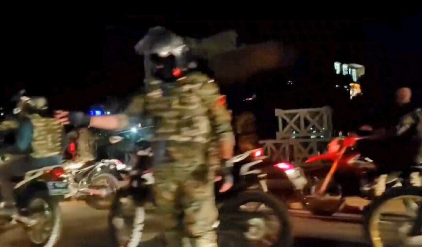 Iranian security forces in the city of Arak, Markazi province, seen in an image from video footage made available on the ESN platform on September 25, 2022 