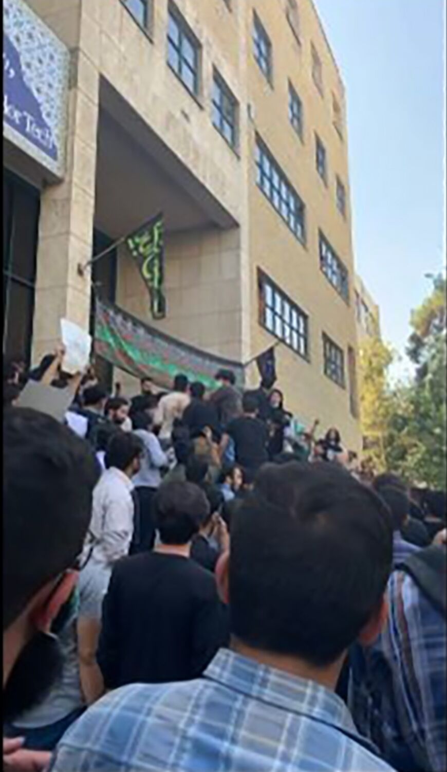 Students of the Amirkabir University of Technology (Tehran Polytechnic) clash with plain clothes security forces during a protest in Iran's capital Tehran on September 19