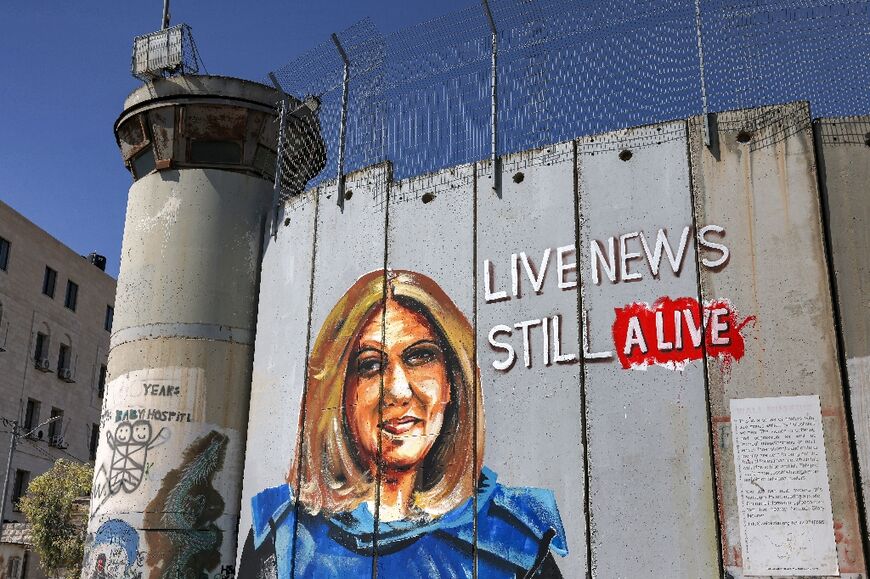 A mural depicting slain Al Jazeera journalist Shireen Abu Akleh, who was killed while covering an Israeli army raid in Jenin in May, painted on Israel's separation barrier in Bethlehem in the occupied West Bank