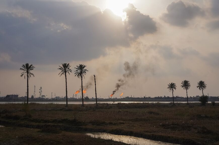 Climate victim: oil well flare near the southern Iraqi city of Basra. The country is one of the worst hit by global warming