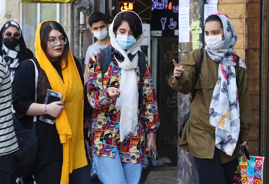 The mandatory dress code in force since soon after the Islamic revolution requires women to conceal their hair but women in Iran's big cities particularly routinely let their headscarves fall back