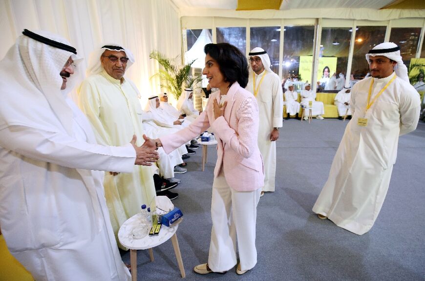 Another woman candidate, Alia al-Khaled, receives guests in her campaign tent in Kuwait City ahead of Thursday's vote for the only fully elected parliament in the Gulf Arab states