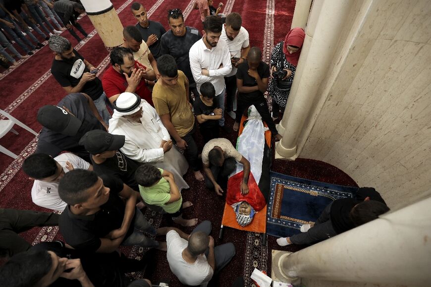 Mourners bid farewell to Abed Hazem, the brother of Raad Hazem -- a Palestinian who had carried out a deadly shooting attack in Tel Aviv in April -- after he was killed in an Israeli raid