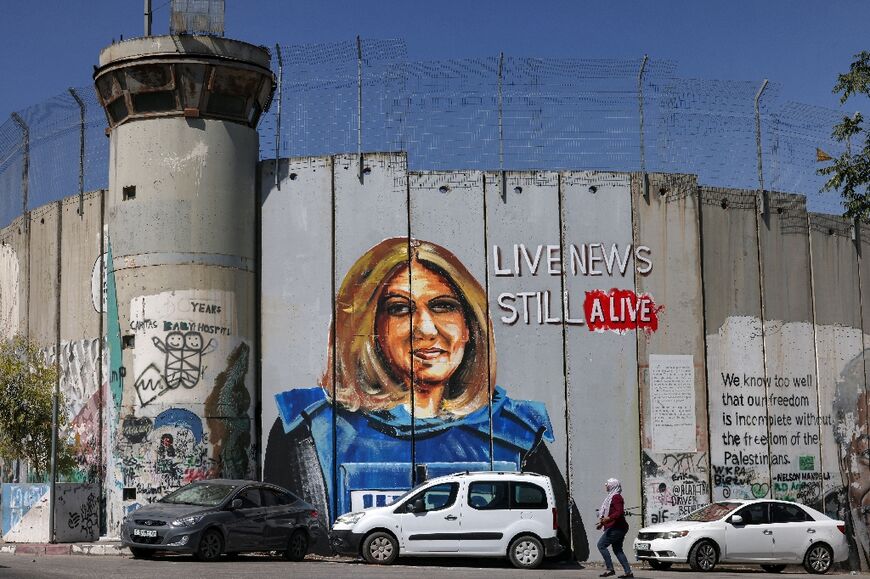 A mural depicting slain Al Jazeera journalist Shireen Abu Akleh, who was killed while covering an Israeli army raid in Jenin in May, has been painted on Israel's separation barrier in Bethlehem in the occupied West Bank