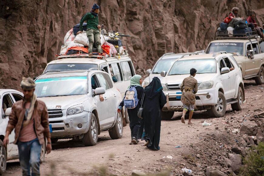 Blocked traffic on a damaged narrow road that serves as a lifeline between Yemen's third-largest city of Taez, besieged by Huthi rebels, and the southern port of Aden