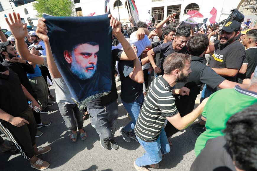 Iraqi supporters of Shiite Muslim cleric Moqtada Sadr gather in Tahrir Square in Baghdad on September 28, 2022 