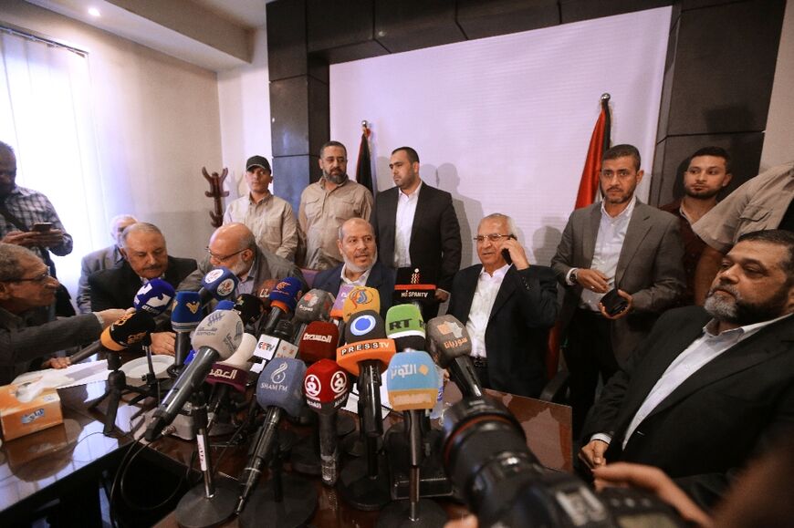 Representatives of Hamas and allied groups hold a press conference during a visit to the Syrian capital Damascus on October 19, 2022 for the first time since the Palestinian Islamist group severed ties with Syria a decade ago