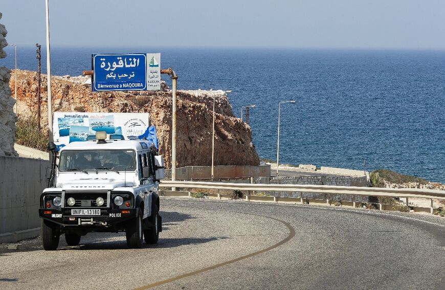 United Nations peacekeepers drive on the coastal road to Naqura, the southernmost Lebanese town by the border with Israel on Monday