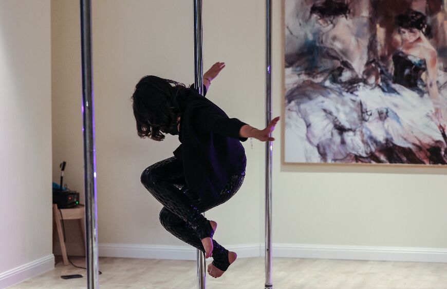 Pole dancing 'needs a lot of strength to be able to do it', said a student in Riyadh