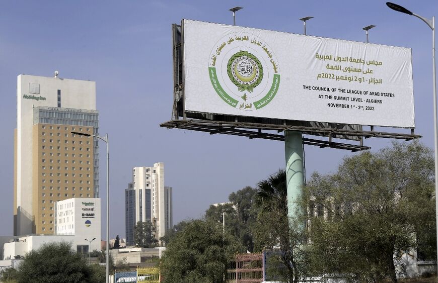 A billboard announces the 31st ordinary session of the Arab League Heads of State summit  in Algiers