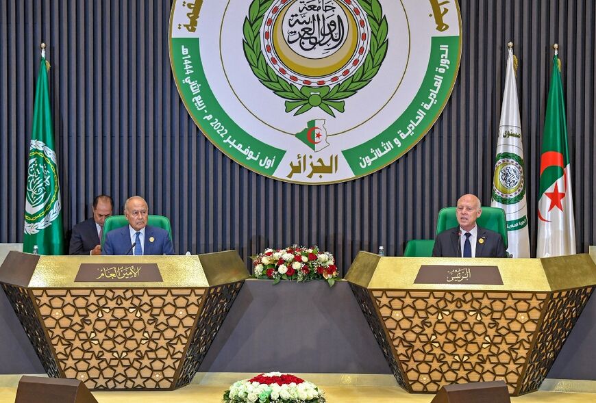 Arab League Secretary-General Ahmed Aboul Gheit (L) and Tunisian President Kais Saied (R) are seen at the opening of the summit 