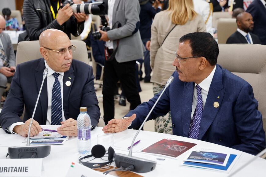 Mauritanian President Mohamed Ould Ghazouani (L) attends with Niger's President Mohamed Bazoum a working session during the International Organisation of Francophonie summit in Tunisia