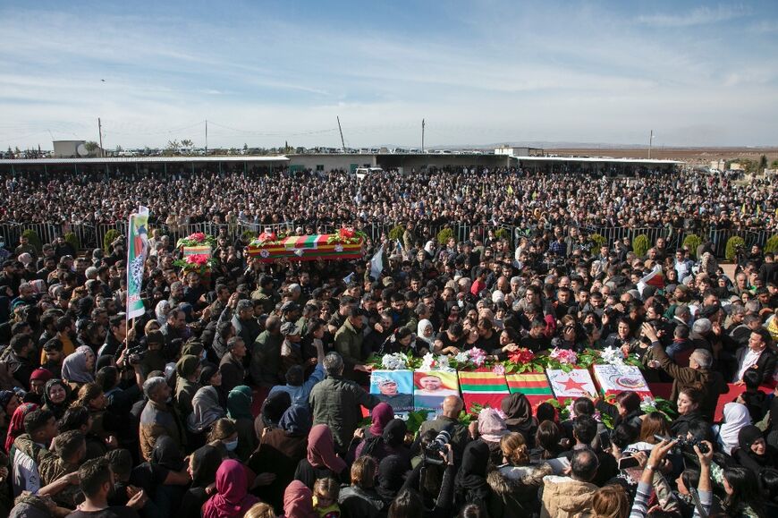 Thousands attend a funeral for 11 people killed in Turkish air strikes 