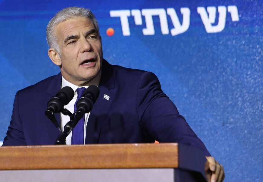 Israeli caretaker Prime Minister and head of the Yesh Atid party Yair Lapid addresses supporters at campaign headquarters in Tel Aviv early on November 2, 2022, after the end of voting