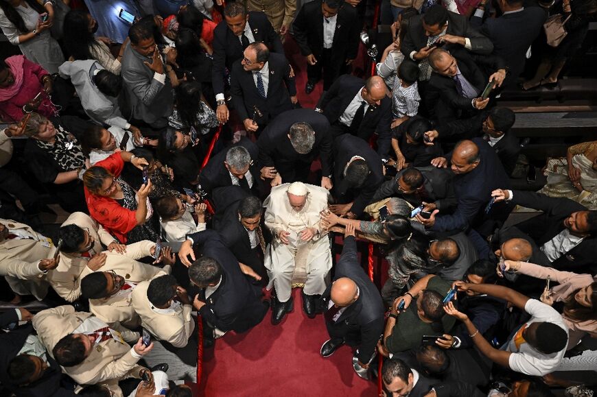 Pope Francis leaves the Cathedral of Our Lady of Arabia in Awali, south of the Bahraini capital Manama