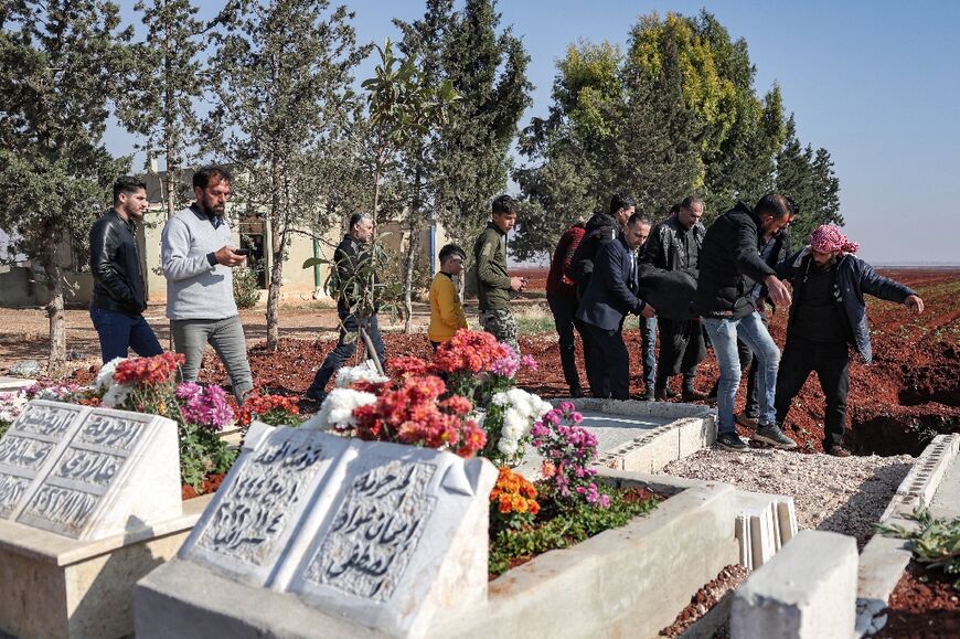 Mourners bury a victim of a bombardment on the northern Syrian city of Azaz 
