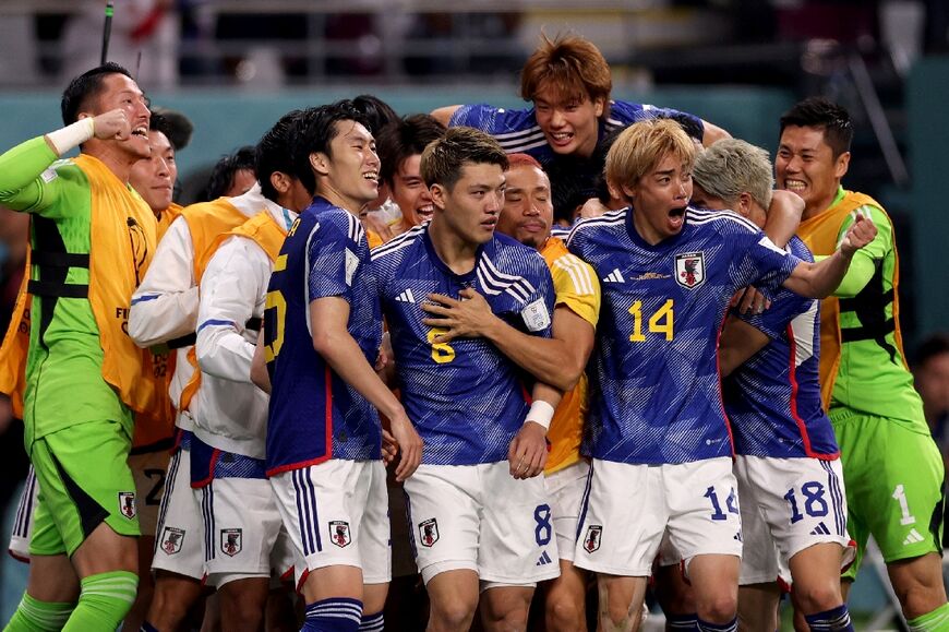 Japan produced a stunning comeback to claim a shock 2-1 win over Germany on Wednesday