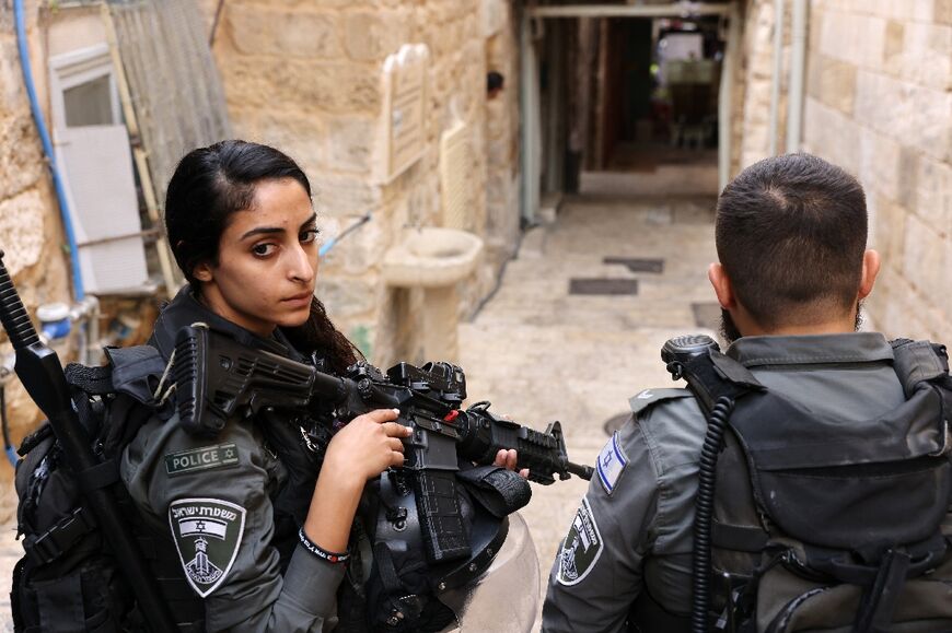 Israeli security forces gather at the scene in the Old City of Jerusalem, where an assailant reportedly stabbed at least one Israeli officer before being shot dead, on November 3, 2022