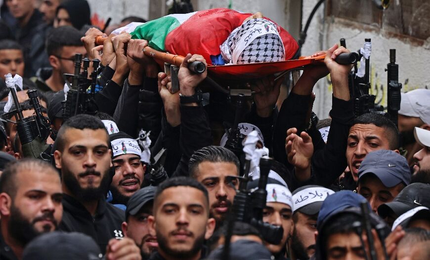 Mourners carry the body of Palestinian teenager Mahdi Hashash. The Al-Aqsa Martyrs' Brigades, the armed wing of Palestinian president Mahmud Abbas's secular Fatah movement, issued a statement claiming Hashash as one of its members