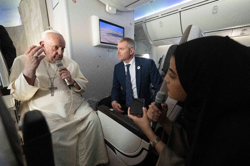 Pope Francis answers a question from Fatima Khaled al-Najem, Bahrain News Agency reporter, during the flight back to Rome, after his apostolic journey to Bahrain, on November 6, 2022