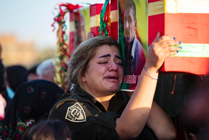 A mourner in the funeral procession of two civilians, sympathisers of the Syrian Democratic Forces (SDF), killed  in a Turkish drone attack in Syria's northeastern Kurdish-majority city of Qamishli, on October 29, 2022