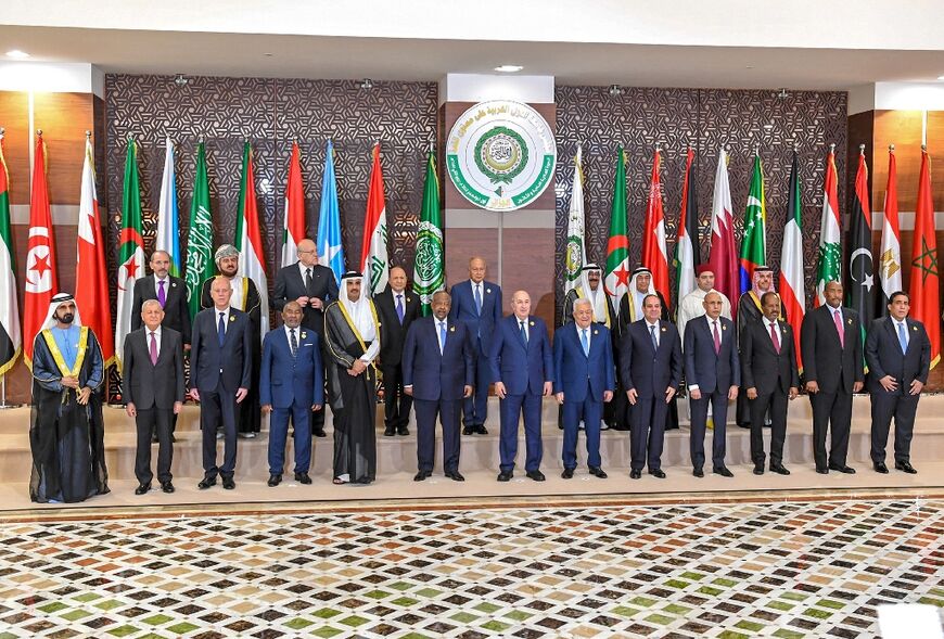 Arab leaders pose for a group photo in the Algerian capital for the first Arab League summit since a string of normalisation deals with Israel that have divided the region