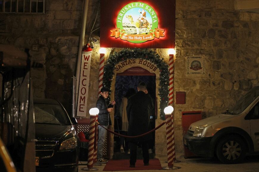Visitors at Santa's House in Jerusalem's Old City are welcomed to the 'Ho Ho Holy Land'