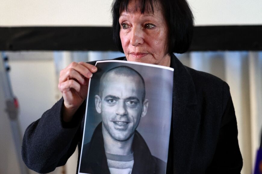 'We didn't think it was possible to deport somebody from his birthplace,' said Denise Guidoux, pictured with a photo of her son Salah Hamouri